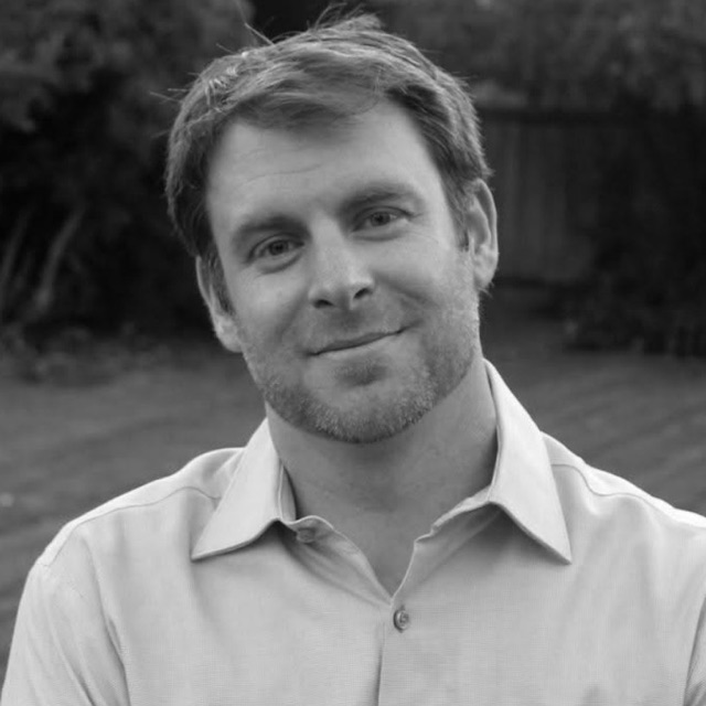 Jeff, smiling in a backyard